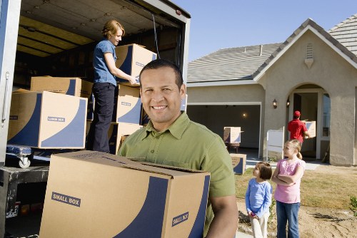 Loading furniture into a moving truck in Mortlake